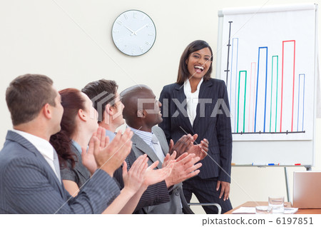 Business people applauding her colleague in a meeting Business people applauding her colleague in a meeting 6197851