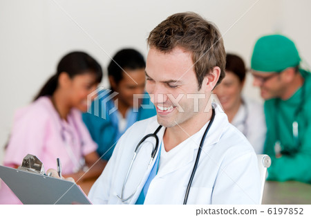 Young male Doctor Smiling at the camera Young male Doctor Smiling at the camera 6197852