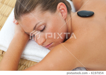 Relaxed woman getting spa treatment Relaxed woman getting spa treatment 6197854