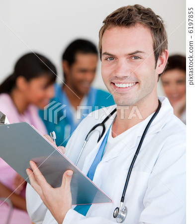 Young male Doctor Smiling at the camera Young male Doctor Smiling at the camera 6197855