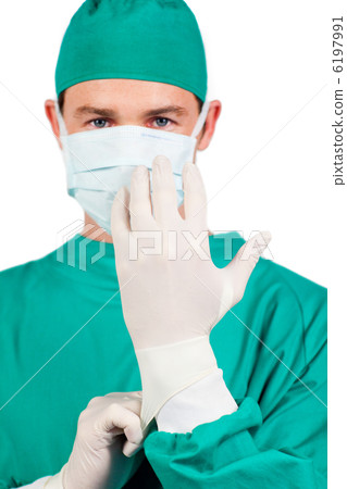 Serious surgeon wearing surgical gloves 6197991