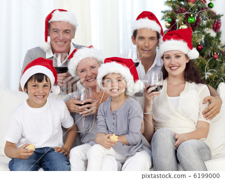 Family celebrating Christmas with wine and sweets Family celebrating Christmas with wine and sweets 6199000