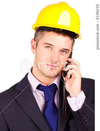 Construction worker talking on the phone Construction worker talking on the phone 6199250