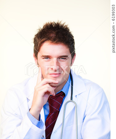 Friendly young doctor looking at the camera Friendly young doctor looking at the camera 6199303
