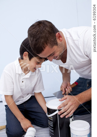 Father and son preparing paint Father and son preparing paint 6199304