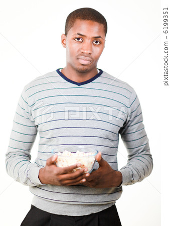 Man holding pop corn Man holding pop corn 6199351