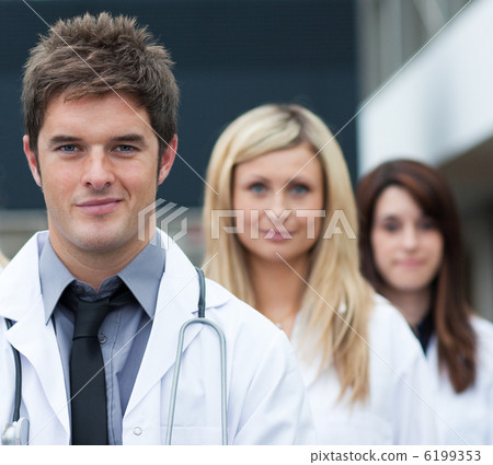 Handsome young doctor leading his team Handsome young doctor leading his team 6199353