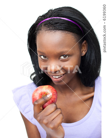 Attractive young woman eating an apple Attractive young woman eating an apple 6199360