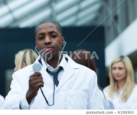 Handsome Afro-American doctor leading his team Handsome Afro-American doctor leading his team 6199363