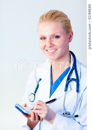 Female doctor writing a perscription 6199680