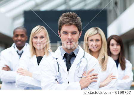 Handsome young doctor leading his team Handsome young doctor leading his team 6199737