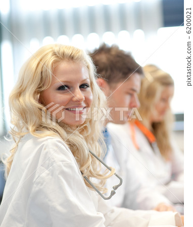 Team of doctors at a meeting Team of doctors at a meeting 6200021