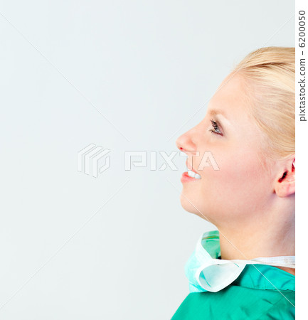 Female Surgeon with her mask off Female Surgeon with her mask off 6200050