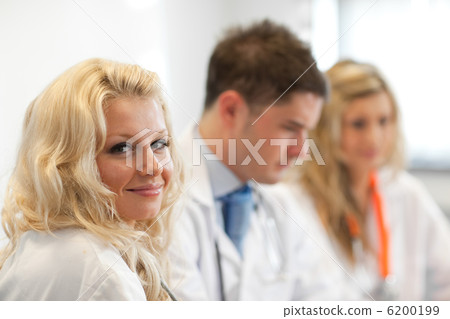 Team of doctors at a meeting Team of doctors at a meeting 6200199