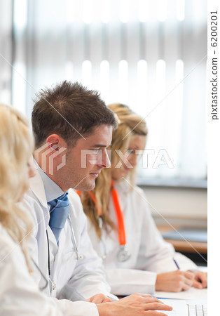 Team of doctors at a meeting Team of doctors at a meeting 6200201