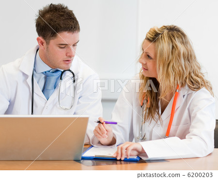 Two doctors working together Two doctors working together 6200203
