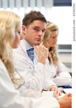Team of doctors at a meeting Team of doctors at a meeting 6200204