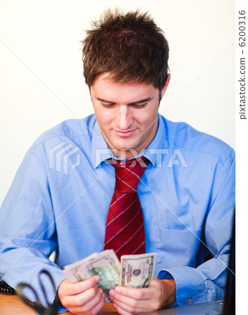 Businessman counting money Businessman counting money 6200316