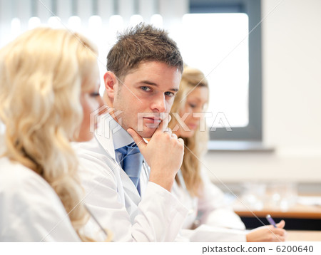 Team of doctors at a meeting Team of doctors at a meeting 6200640