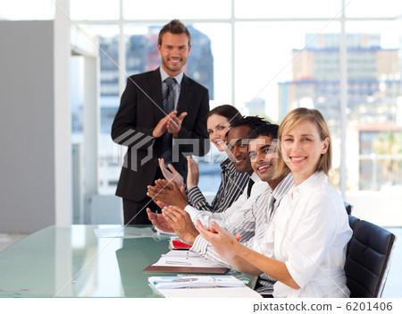 Stock Photo: Businessteam clapping at the end of a presentation