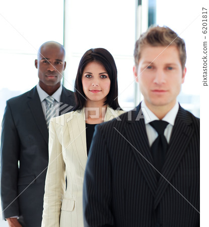 Confident usinesswoman in focus with her team Confident usinesswoman in focus with her team 6201817