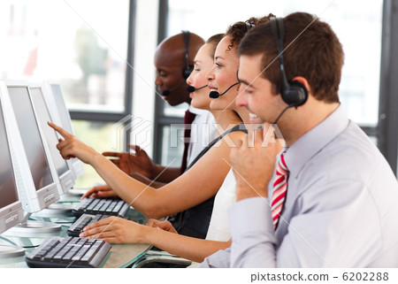 Attractive businessman working in a call center 6202288
