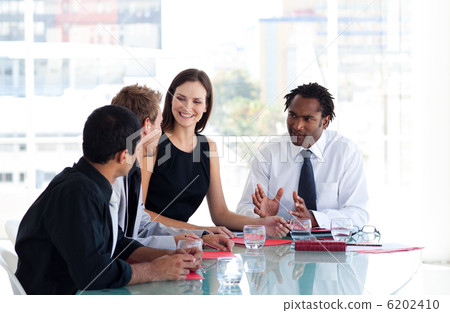 Business team interacting to each other in office Business team interacting to each other in office 6202410