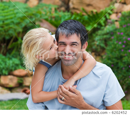 Daughter kissing her father Daughter kissing her father 6202452