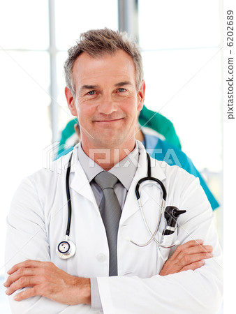 Senior doctor with folded arms Senior doctor with folded arms 6202689