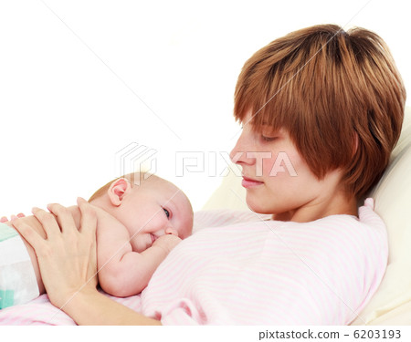 Mother looking at her newborn baby Mother looking at her newborn baby 6203193