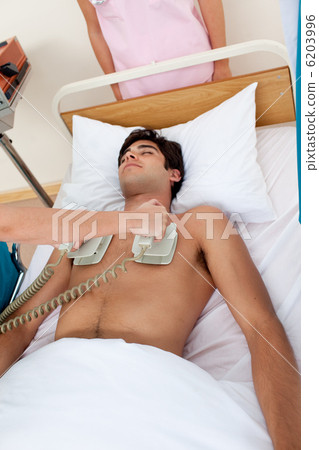 A doctor resuscitating a patient 6203996