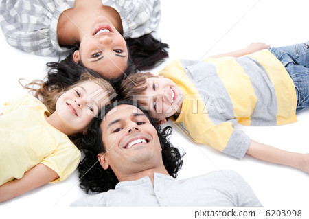 Cute family lying on the floor together 6203998