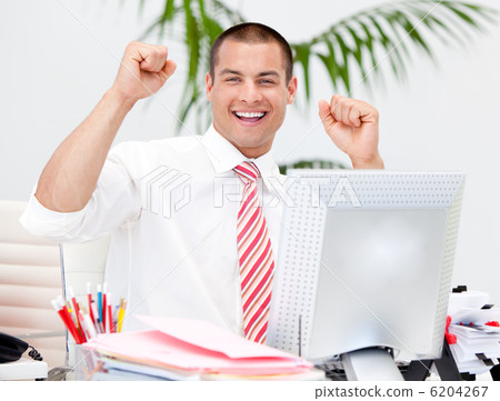 Cheerful businessman punching the air in celebration Cheerful businessman punching the air in celebration 6204267