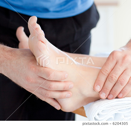 Close-up of a woman enjoying a foot massage Close-up of a woman enjoying a foot massage 6204305