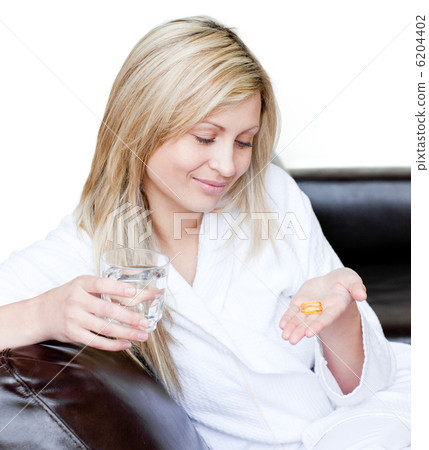 Radiant woman holding medicine Radiant woman holding medicine 6204402