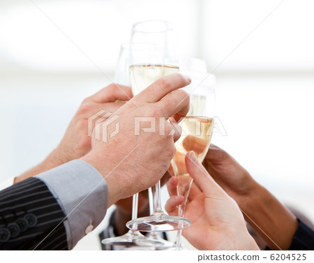 Close-up of businessmen celebrating an event with champagne Close-up of businessmen celebrating an event with champagne 6204525