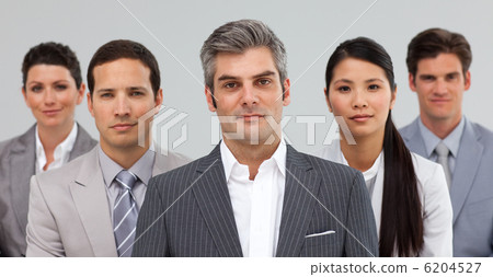 Serious busines people standing together Serious busines people standing together 6204527
