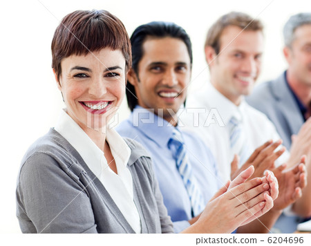 A diverse business group clapping a good presentation A diverse business group clapping a good presentation 6204696