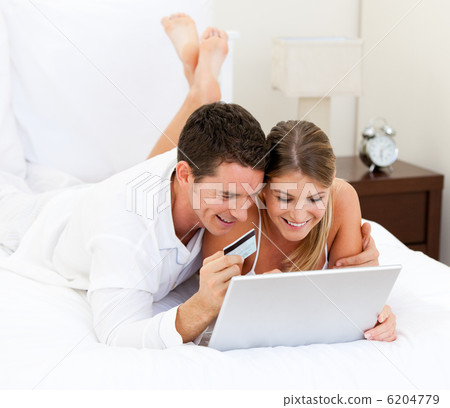 Caucasian couple surfing on the internet Caucasian couple surfing on the internet 6204779