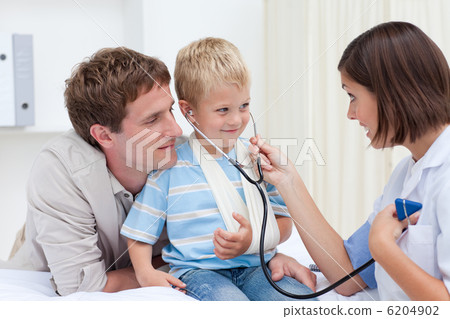 Female doctor playing with a little child 6204902