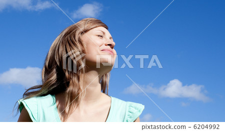 Portrait of a caucasian woman relaxing outdoor Portrait of a caucasian woman relaxing outdoor 6204992