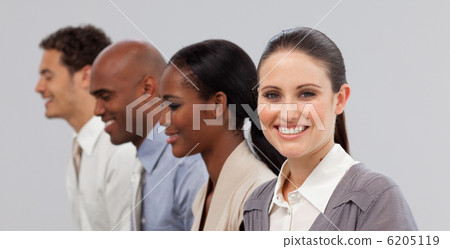 Diverse young business people sitting in a line Diverse young business people sitting in a line 6205119