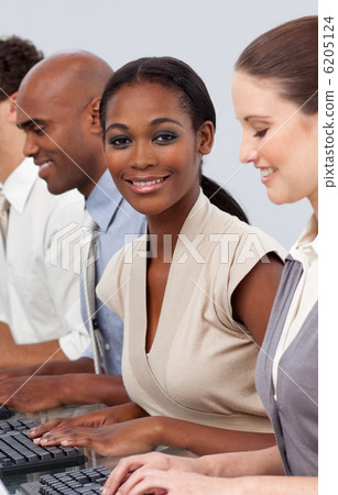 Afro-american businesswoman sitting in a line with her colleague Afro-american businesswoman sitting in a line with her colleague 6205124