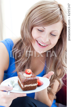 Happy woman holding a piece of chocolate cake 6205147