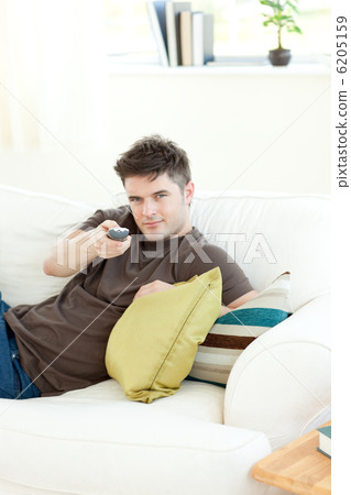 Self-assured man is relaxing Self-assured man is relaxing 6205159