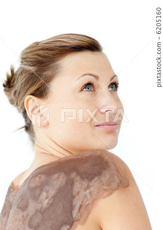 Portrait of a woman enjoying a mud skin treatment Portrait of a woman enjoying a mud skin treatment 6205160