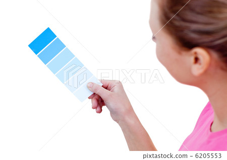 Caucasian woman choosing a color to decorate her house 6205553