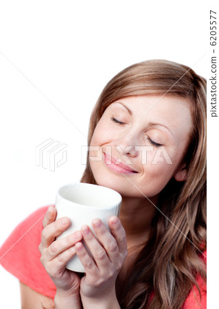 Beautiful woman drinking a cup of tea Beautiful woman drinking a cup of tea 6205577
