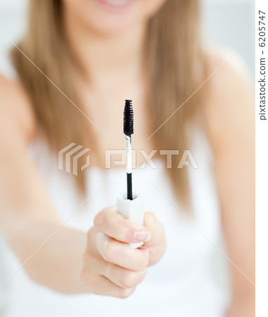 Close-up of woman holding make-up Close-up of woman holding make-up 6205747