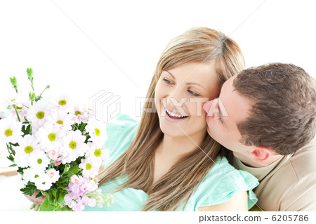 Enamored man giving a bouquet to his girlfriend 6205786